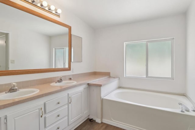 34387 Wolahi Rd, Julian, CA 92036 - bathroom with a garden tub, double vanity, and wood finished floors