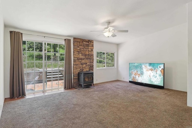 34387 Wolahi Rd, Julian, CA 92036 - unfurnished living room featuring a wood stove, a ceiling fan, and carpet