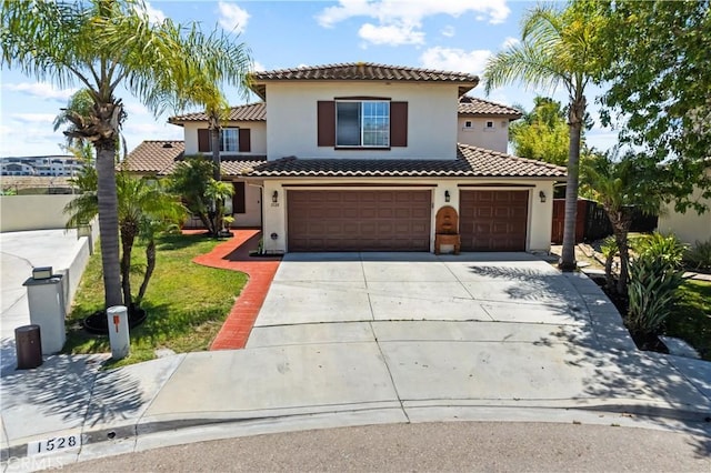 1528 Hendrix Pl, Chula Vista, CA 91911 - mediterranean / spanish-style house featuring concrete driveway, stucco siding, a tiled roof, a garage, and an attached garage