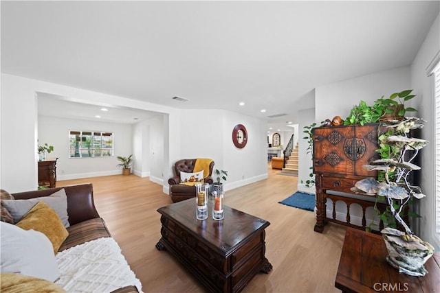 1528 Hendrix Pl, Chula Vista, CA 91911 - living room with stairs, light wood finished floors, recessed lighting, plenty of natural light, and baseboards