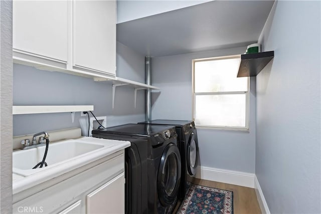 1528 Hendrix Pl, Chula Vista, CA 91911 - washroom with washing machine and dryer, cabinet space, baseboards, and wood finished floors