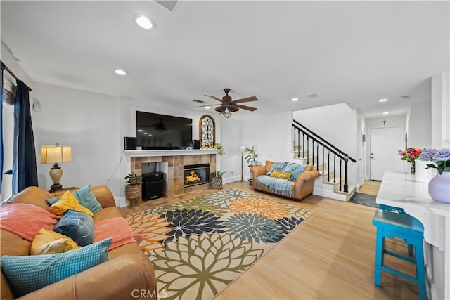 1528 Hendrix Pl, Chula Vista, CA 91911 - living room with stairway, wood finished floors, a tile fireplace, a ceiling fan, and recessed lighting