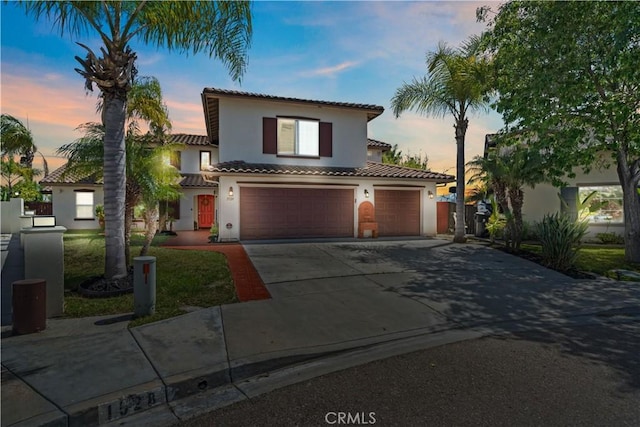1528 Hendrix Pl, Chula Vista, CA 91911 - mediterranean / spanish-style house featuring stucco siding, a tiled roof, concrete driveway, an attached garage, and a garage