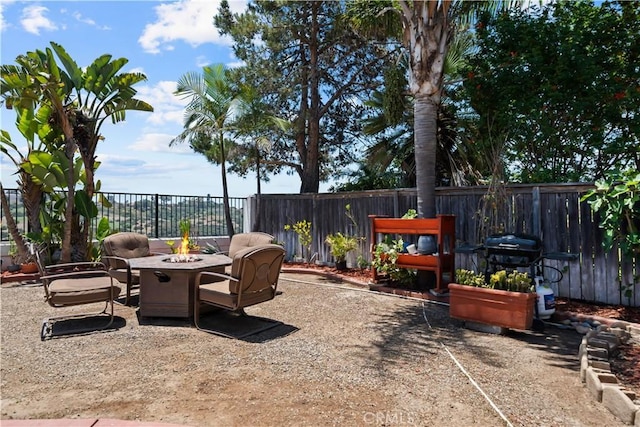 1528 Hendrix Pl, Chula Vista, CA 91911 - fenced backyard featuring an outdoor fire pit and a patio