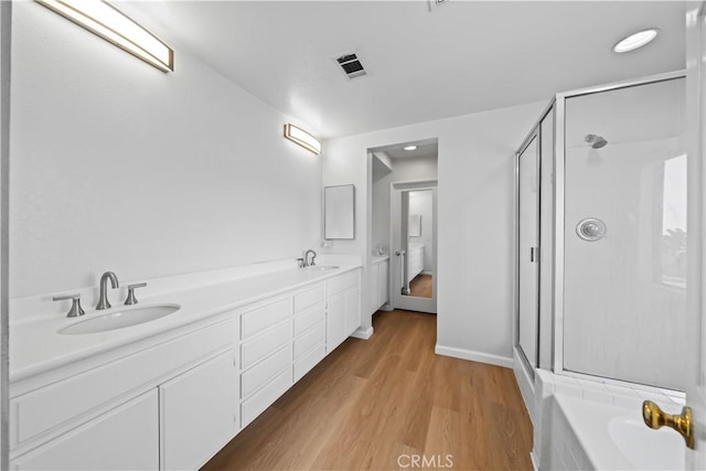1528 Hendrix Pl, Chula Vista, CA 91911 - bathroom with a stall shower, wood finished floors, double vanity, and a garden tub