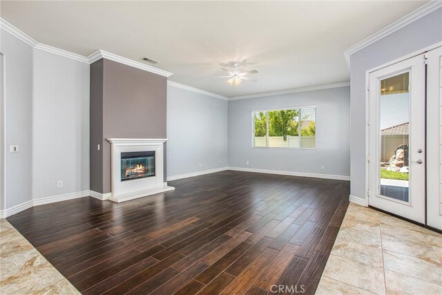 967 Hidden Oaks, Beaumont, CA 92223 - unfurnished living room with wood finished floors, ceiling fan, baseboards, crown molding, and a glass covered fireplace