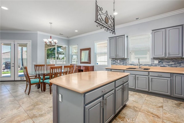 967 Hidden Oaks, Beaumont, CA 92223 - kitchen with gray cabinetry, a sink, healthy amount of natural light, decorative backsplash, and recessed lighting