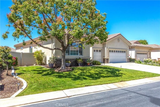 967 Hidden Oaks, Beaumont, CA 92223 - mediterranean / spanish house with stucco siding, a garage, stone siding, driveway, and a tiled roof