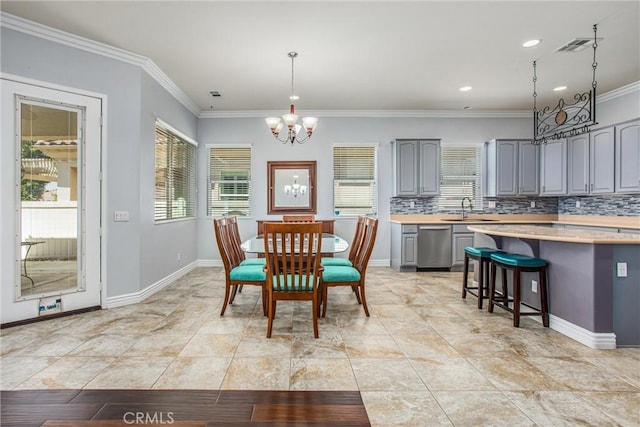 967 Hidden Oaks, Beaumont, CA 92223 - dining area featuring a chandelier, crown molding, recessed lighting, and baseboards