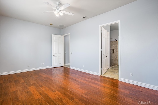 967 Hidden Oaks, Beaumont, CA 92223 - unfurnished bedroom with wood finished floors, baseboards, and connected bathroom