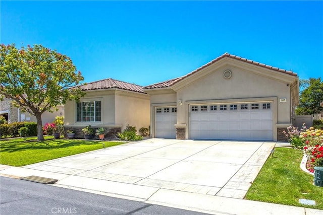 967 Hidden Oaks, Beaumont, CA 92223 - mediterranean / spanish-style house featuring stucco siding, an attached garage, a front lawn, driveway, and stone siding