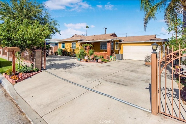 10636 Wolfe Ave, Riverside, CA 92505 - single story home with driveway, an attached garage, and central AC unit