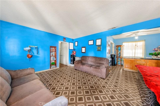 10636 Wolfe Ave, Riverside, CA 92505 - living area with vaulted ceiling, ceiling fan, and a textured ceiling