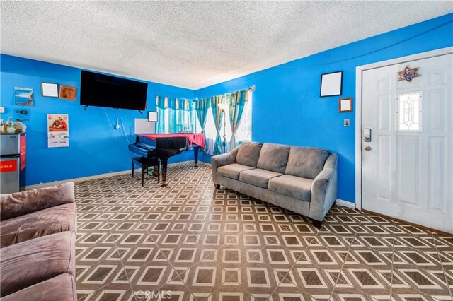 10636 Wolfe Ave, Riverside, CA 92505 - living room with a textured ceiling and baseboards