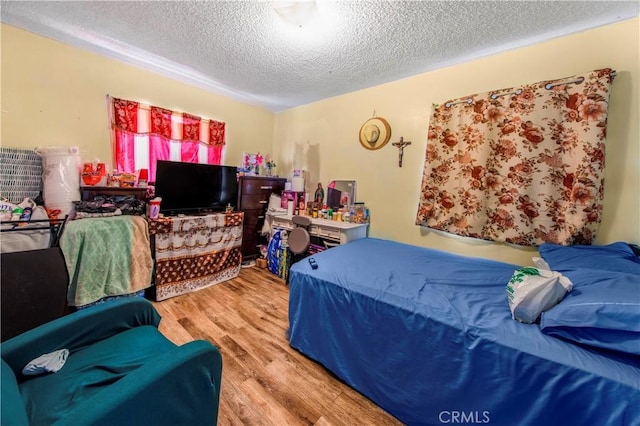 10636 Wolfe Ave, Riverside, CA 92505 - bedroom with wood finished floors and a textured ceiling