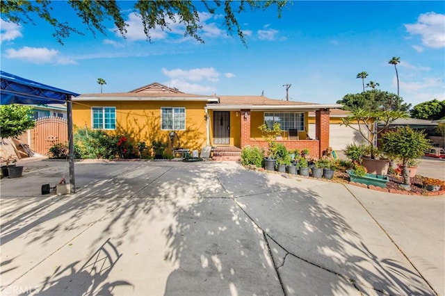 10636 Wolfe Ave, Riverside, CA 92505 - single story home featuring brick siding and a gate