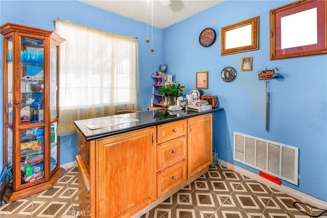 10636 Wolfe Ave, Riverside, CA 92505 - bar area featuring baseboards, ceiling fan, and tile patterned floors