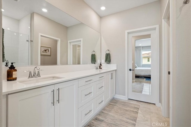 3516 Brody Way, Oceanside, CA 92056 - full bathroom with double vanity, connected bathroom, tiled shower, and recessed lighting