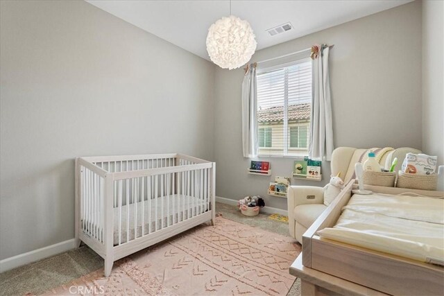 3516 Brody Way, Oceanside, CA 92056 - bedroom with carpet flooring, baseboards, and a chandelier