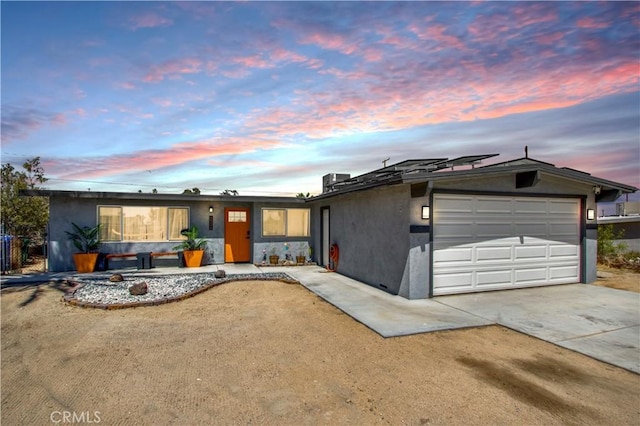 5536 Cahuilla Ave Unit 29, Palms, CA 92277 - ranch-style house with stucco siding, driveway, and a garage