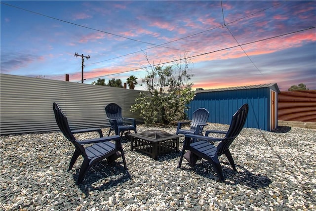 5536 Cahuilla Ave Unit 29, Palms, CA 92277 - view of patio with a fire pit and an outdoor structure