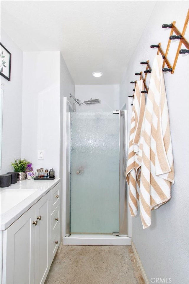 5536 Cahuilla Ave Unit 29, Palms, CA 92277 - full bathroom featuring a shower stall, vanity, and baseboards