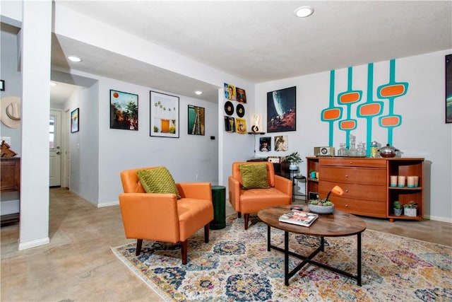 5536 Cahuilla Ave Unit 29, Palms, CA 92277 - living room with recessed lighting, baseboards, and concrete flooring