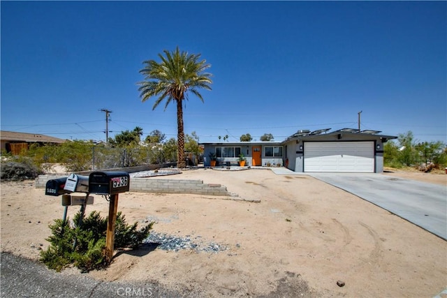 5536 Cahuilla Ave Unit 29, Palms, CA 92277 - view of front of home featuring an attached garage and concrete driveway