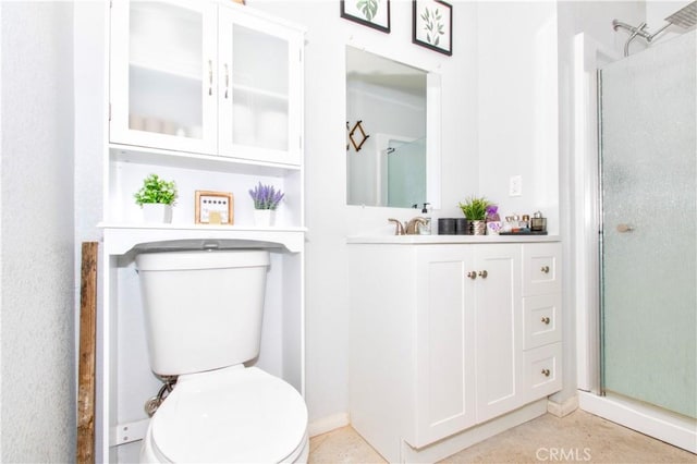 5536 Cahuilla Ave Unit 29, Palms, CA 92277 - bathroom with toilet, vanity, a stall shower, and baseboards