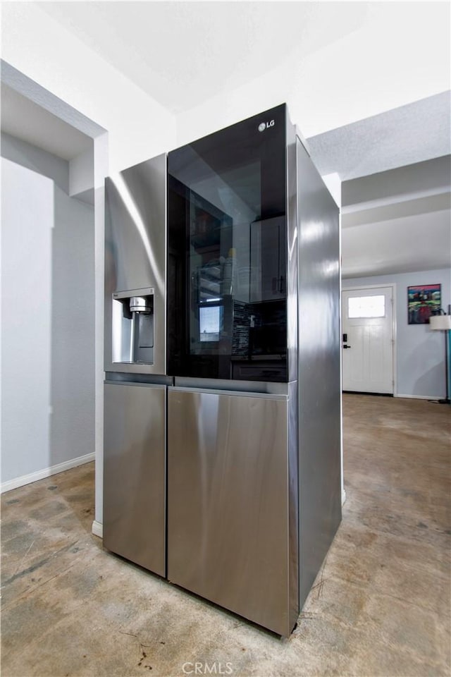 5536 Cahuilla Ave Unit 29, Palms, CA 92277 - kitchen with stainless steel refrigerator with ice dispenser and baseboards