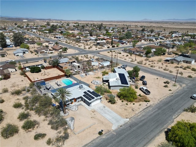 5536 Cahuilla Ave Unit 29, Palms, CA 92277 - aerial view of residential area featuring a mountainous background and a desert landscape