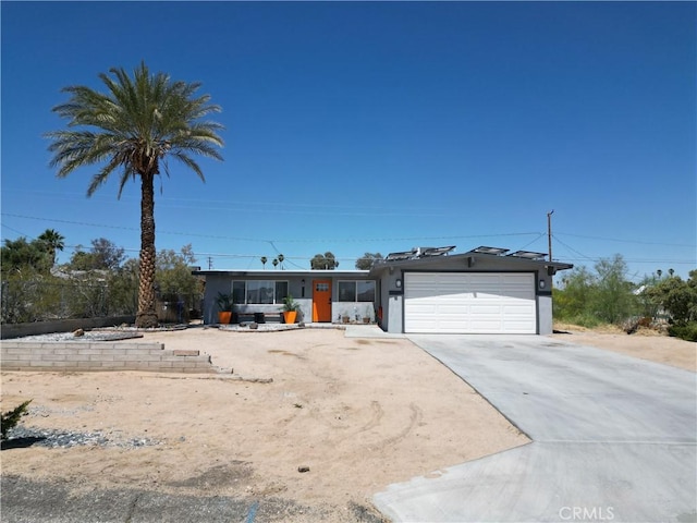 5536 Cahuilla Ave Unit 29, Palms, CA 92277 - ranch-style house with a garage, concrete driveway, and stucco siding
