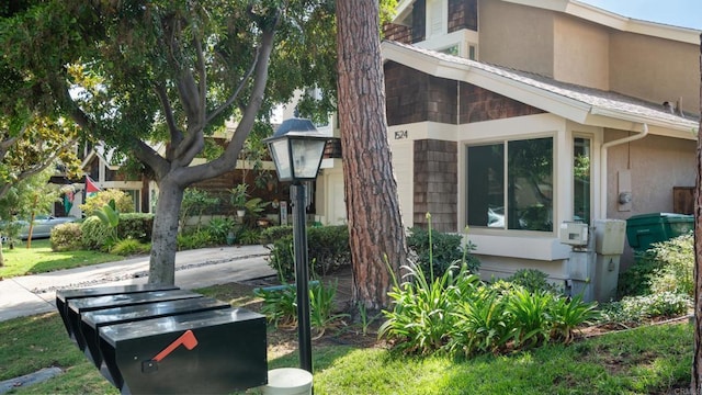 1524 Bridgeview Dr, San Diego, CA 92105 - view of side of home featuring stucco siding
