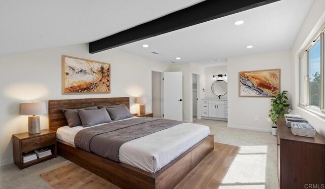 1524 Bridgeview Dr, San Diego, CA 92105 - bedroom with light carpet, beamed ceiling, recessed lighting, baseboards, and connected bathroom