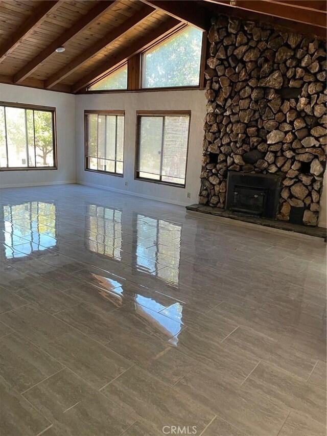 9275 Sheep Ranch Rd, Mountain Ranch, CA 95246 - unfurnished living room featuring wooden ceiling with exposed beams and high vaulted ceiling