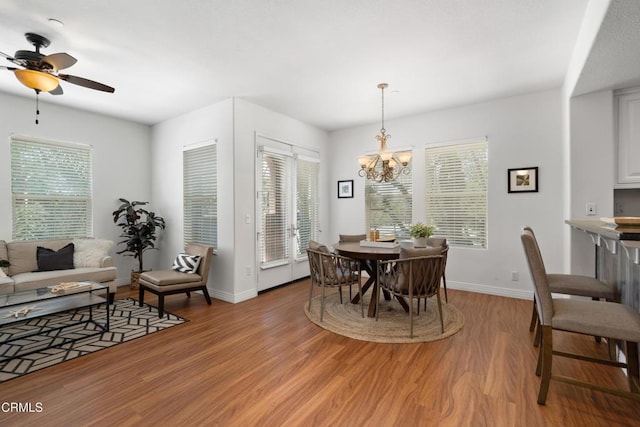 433 N Altadena Dr Unit 4, Pasadena, CA 91107 - dining space with light wood-style flooring, a ceiling fan, a chandelier, and baseboards