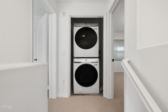 433 N Altadena Dr Unit 4, Pasadena, CA 91107 - washroom with stacked washer / dryer and light colored carpet
