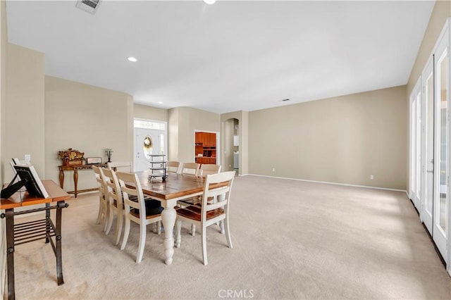 26716 Kingwood Rd, Murrieta, CA 92563 - dining space with recessed lighting, arched walkways, light colored carpet, and baseboards