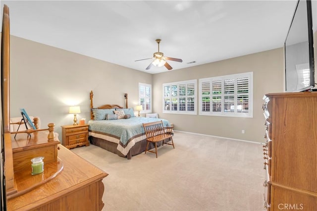 26716 Kingwood Rd, Murrieta, CA 92563 - bedroom with light carpet, baseboards, and ceiling fan