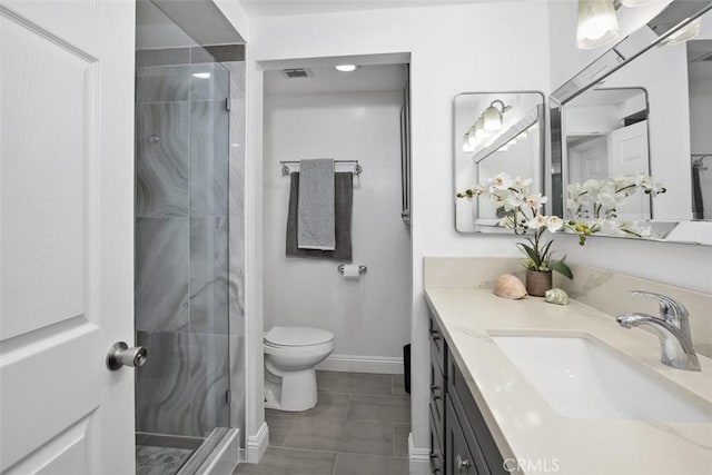 676 Via Alhambra Unit C, Laguna Woods, CA 92637 - full bath with vanity, a shower stall, toilet, baseboards, and tile patterned flooring