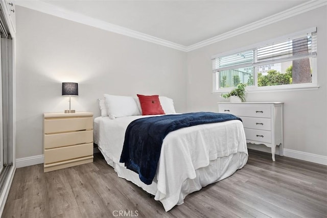 676 Via Alhambra Unit C, Laguna Woods, CA 92637 - bedroom with light wood-style floors, crown molding, and baseboards