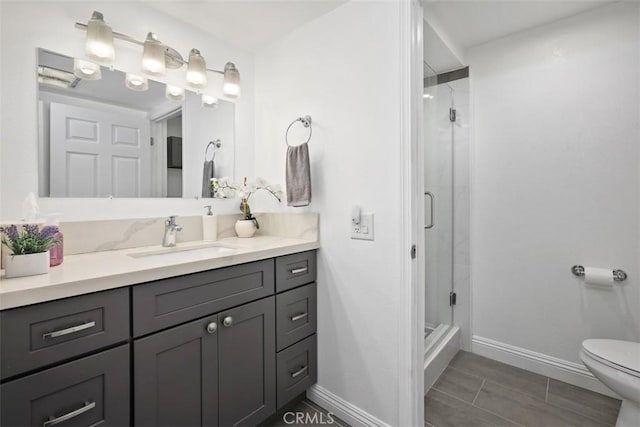 676 Via Alhambra Unit C, Laguna Woods, CA 92637 - full bath with baseboards, vanity, toilet, and a shower stall