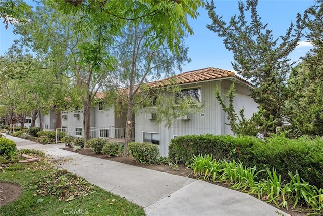 676 Via Alhambra Unit C, Laguna Woods, CA 92637 - view of property featuring a tile roof