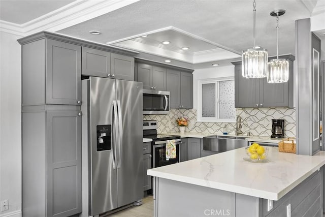 676 Via Alhambra Unit C, Laguna Woods, CA 92637 - kitchen with appliances with stainless steel finishes, a sink, gray cabinetry, ornamental molding, and tasteful backsplash