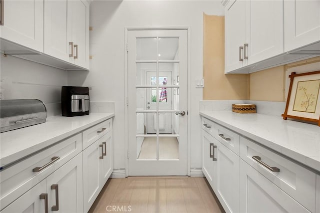487 N Fern St, Orange, CA 92867 - kitchen with white cabinets and light stone counters