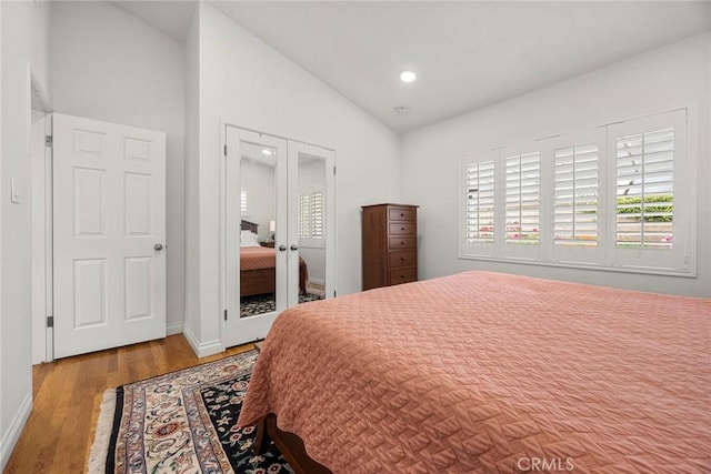 487 N Fern St, Orange, CA 92867 - bedroom with lofted ceiling, french doors, wood finished floors, baseboards, and recessed lighting