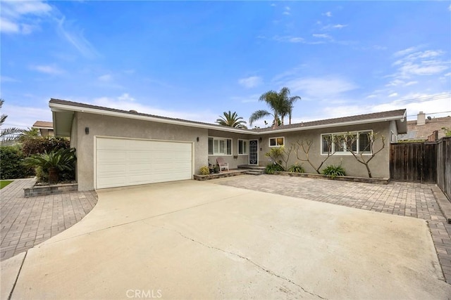 487 N Fern St, Orange, CA 92867 - ranch-style home featuring stucco siding, concrete driveway, and an attached garage