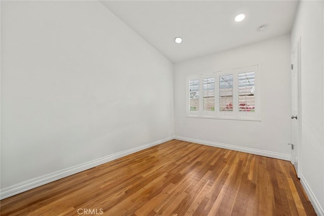 487 N Fern St, Orange, CA 92867 - unfurnished room featuring lofted ceiling, baseboards, light wood finished floors, and recessed lighting