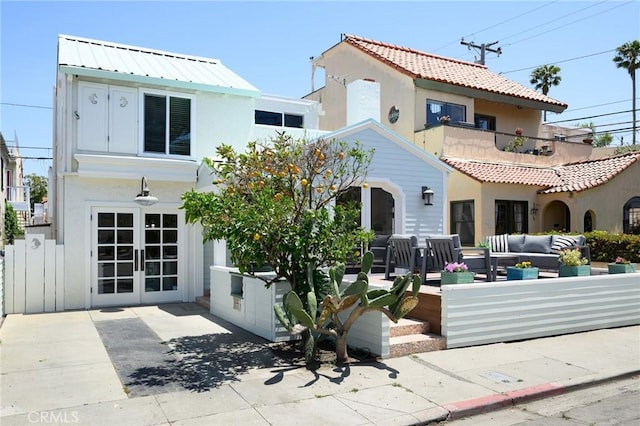 26 Covina Ave, Long Beach, CA 90803 - back of house with outdoor lounge area, stucco siding, french doors, and a patio area