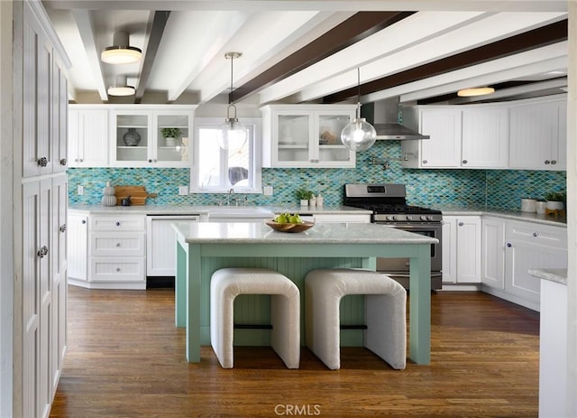 26 Covina Ave, Long Beach, CA 90803 - kitchen featuring stainless steel gas range oven, tasteful backsplash, a sink, wall chimney range hood, and beamed ceiling